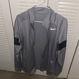 This is a Nike Totality Men's Dri-FIT Versatile Jacket in Cool Grey/Black